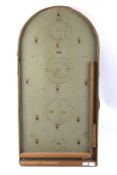 A vintage bagatelle board.
