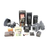 An assortment of vintage cameras and accessories.