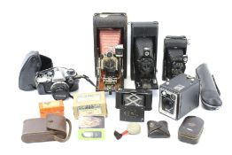 An assortment of vintage cameras and accessories.