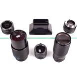 An assortment of Vivitar camera lenses and adaptors. Including a Vivitar Series I No.