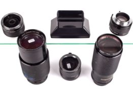 An assortment of Vivitar camera lenses and adaptors. Including a Vivitar Series I No.