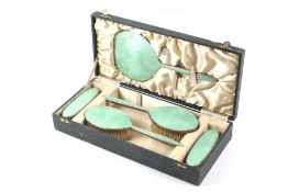 A ladies green enamel vanity set (boxed). Retailer label W. R. Bullen Ltd, Norwich', comb missing.