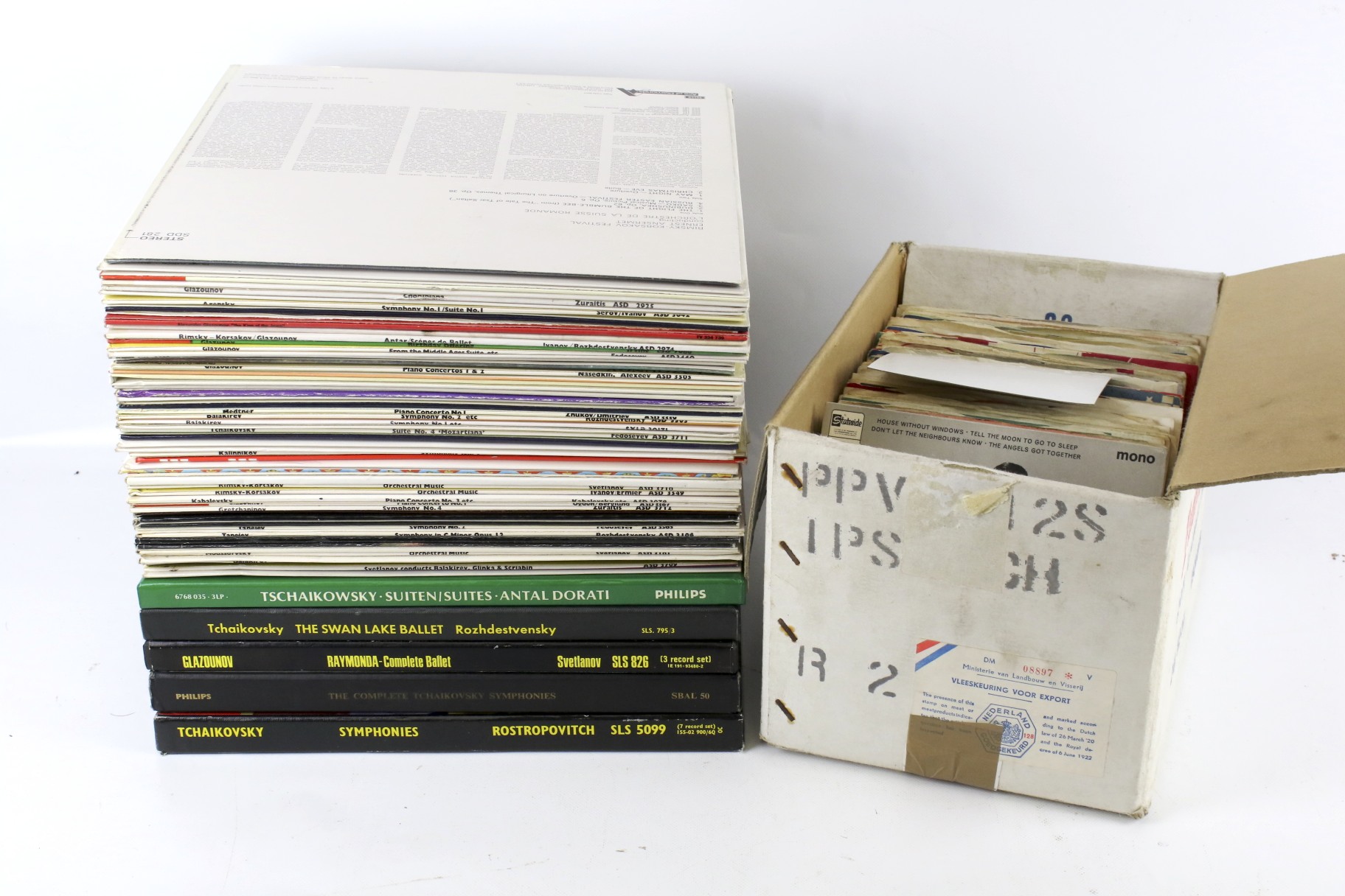 A collection of assorted LP vinyl records and 7" vinyl singles.