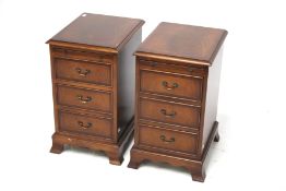 A pair of Georgian style reproduction bedside cabinets.