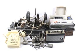 An assortment of items. Including a Roberts radio, a vintage telephone, etc.