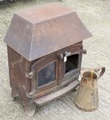 A vintage Villager wood burner and a metal jug. Woodburner H73.