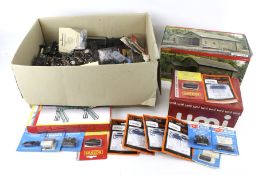 A collection of OO gauge model railway accessories. Including a boxed engine shed, track, etc.