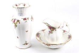 Three pieces of Old Country Roses ceramics. Comprising a bowl, a jug and a vase. Max. H30.