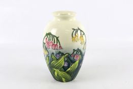 An Old Tupton Ware vase.