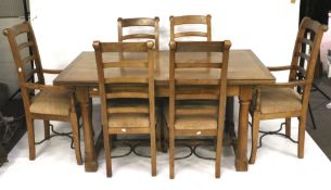 A contemporary rectangular dining table and six chairs.