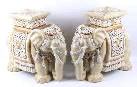 A pair of plant stands modelled as elephants. Glazed in yellow and brown with pierced details, H44.