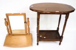 A contemporary pine swing mirror and an oak side table.