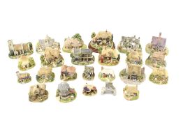 A collection of Lilliput Lane resin cottage ornaments.