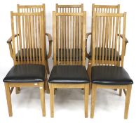A set of six contemporary oak chairs.