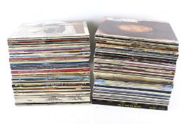 A large collection of mostly 1980s LP vinyl records.