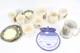 An assortment of ceramics. Including Royal commemorative ware, a Royal Copenhagen plaque, etc.