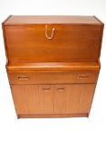 A mid-century teak bureau.