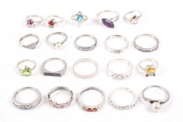 A collection of twenty assorted silver rings.