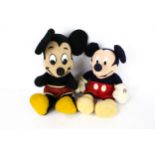 Two vintage Mickey Mouse toys.