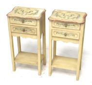 A pair of painted bedside cabinets.