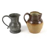 A vintage Royal Doulton stoneware jug and a pewter jug.