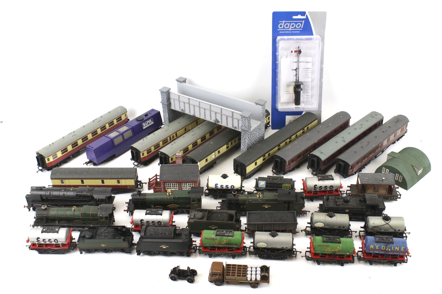 A collection of OO gauge model railway locomotives and coaches.