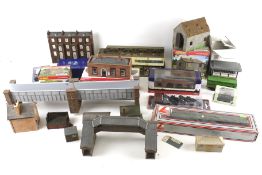 A collection of OO gauge model railway buildings and coaches.