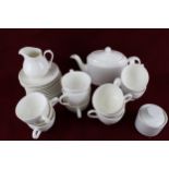 A contemporary white porcelain twelve piece tea service.