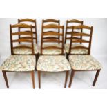 A set of six Mid century G Plan ladder back dining chairs.