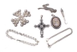 A collection of white metal jewellery.
