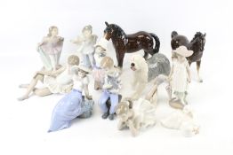 An assortment of ceramic animal and children figures. Including Nao and Beswick examples. Max.