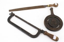 A cast iron hacksaw No 8, a horse shoe rasp and a trivet.