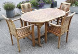 A Solid Wood Company teak garden table and four matching armchairs.