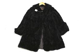 A vintage womens black mole overcoat.