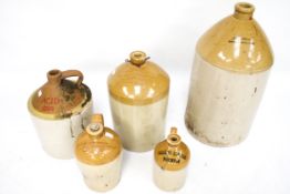 Five vintage stoneware flagons. Including one stamped 'Foster, Banbury'. Max.