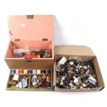 An assortment of buttons and sewing items. Including threads, tape measures, thimbles, etc.