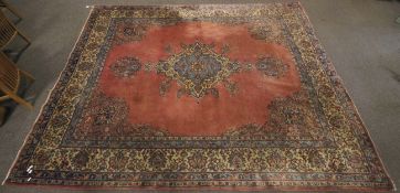 A vintage Persian style wool rug.