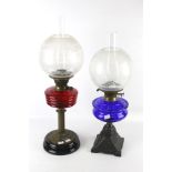 Two 20th century twin burner oil lamps.
