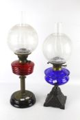 Two 20th century twin burner oil lamps.