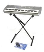 A Yamaha electronic piano keyboard and stand. PSR-290.