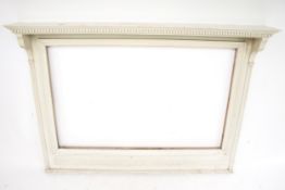 A painted wooden overmantel frame.