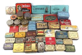 A collection of vintage smoking related tins.