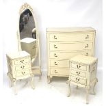 A four piece suite of bedroom furniture in the French style.