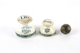 Two W. T. Avery, Birmingham shop scale weights and a Scottish ceramic banded carpet bowl.