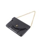 A Christian Dior black leather handbag.