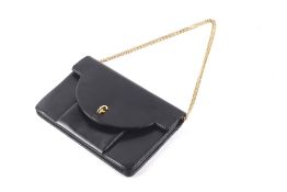 A Christian Dior black leather handbag.