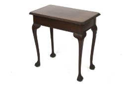 A mahogany rectangular side table. With ball and claw feet.