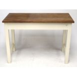 A wooden topped kitchen work table with a white painted base.