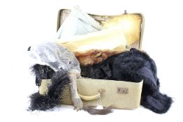 An assortment of vintage fur and feather clothing.