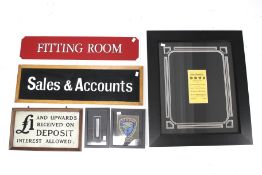Six assorted framed collectables and shop signs. Including 'Fitting Room', 'Sales & Accounts', etc.